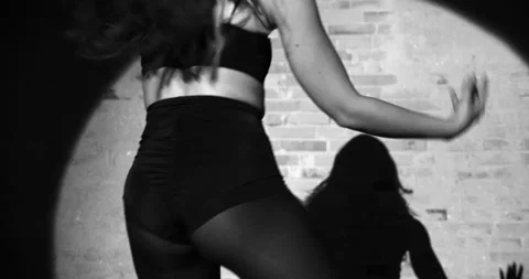 A Lower Viewpoint Shot of an Energetic Dancer Swinging Her Body Sensually Stock Footage 158851925