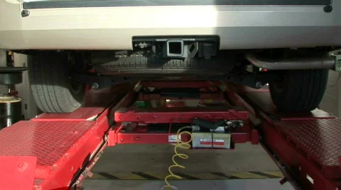 Lowering the car after an oil change Stock-Footage 96953