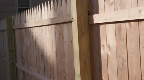 Lowering Down Newly Installed Fence Post Side Stock Footage 68778139