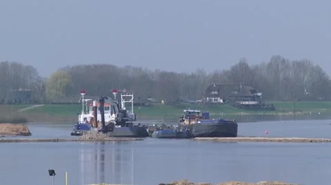 Lowering, excavating a part of the floodplain, using a crane ship Stock Footage 49591100
