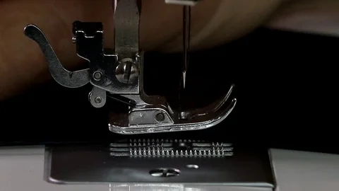Lowering the foot of a sewing machine Stock Footage 82467062