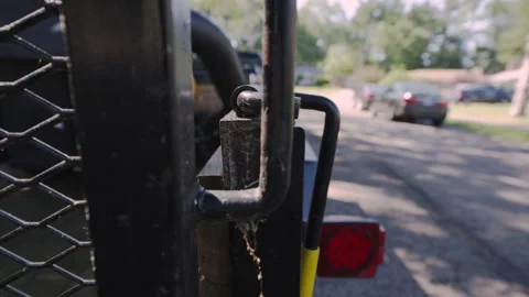 Lowering the gate of the trailer with unlock mechanism. Video stock 277628395