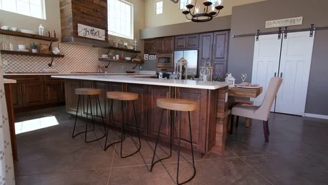 Lowering on Modern Kitchen Island with Stools Stock Footage 76256048