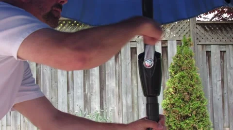 Lowering Patio Umbrella in Backyard Tight Video stock 50762244