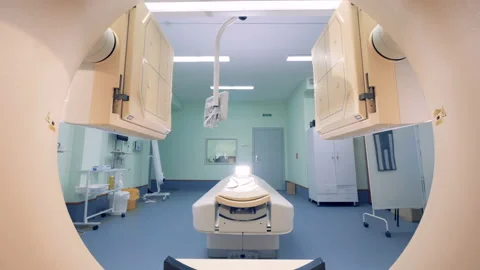 Lowering scanning platforms seen through a target ring of a CAT-scanner Stock Footage 90778194