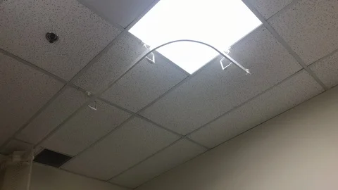 Lowering shot from the ceiling to the floor in a small empty hospital room. Stock Footage 103639180