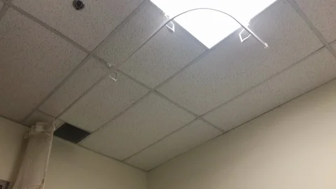 Lowering shot of a hospital bed in an empty room. Stock Footage 103639219