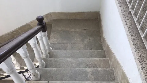 Lowering the steps of an old style building Stock Footage 89572983