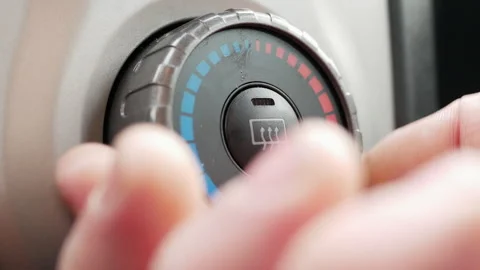 Lowering the temperature in the car interior stove and switch on the rear window Stock Footage 246031407