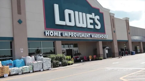 Lowes home improvement warehouse hardware storefront with logo in summer, cars Stock Footage 249097045