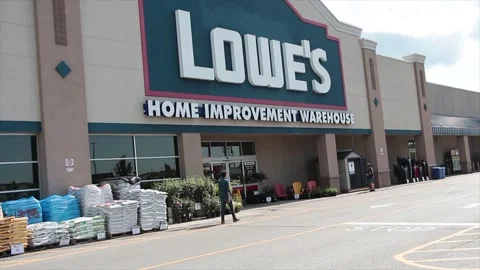 Lowes home improvement warehouse hardware storefront with logo in summer, person Stock Footage 249097157