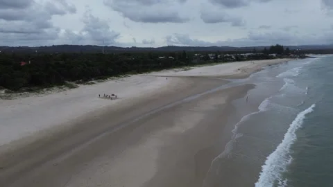 Lowlight Aerial Drone Shot over Australian Beach, Forest &amp; Coastline, Flyover 4K Stock Footage 306316982