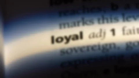 Loyal word in a dictionary. Stock Footage 99563025