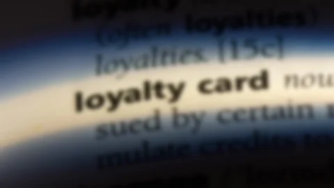 Loyalty card word in a dictionary. Stock Footage 99563045