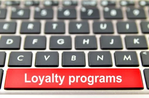 Loyalty programs word on computer space bar Stock Illustration