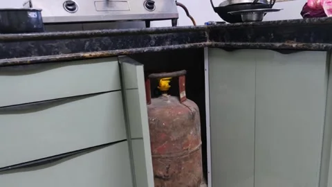 LPG gas cylinder kept inside modular kitchen cabinet Video stock 330738590