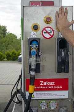LPG refueling button at a self-service gas station. Stock Photos