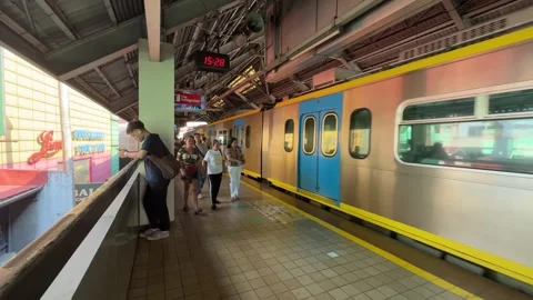 LRT-1 Train Arrival at Station, Pasay 4K 60fps Stock-Footage 338399893
