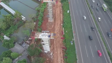 LRT Jakarta Construction, Fly Backward Closeup to Wide View Stock Footage 76661141