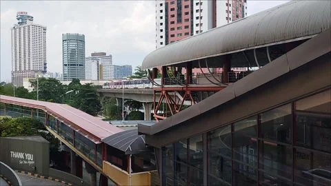 The LRT light rail transit train is moving into the station Stock Footage 326194674
