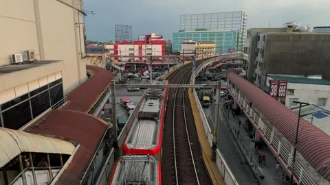 LRT train moving closer to camera at Pasay Taft Avenue station 4K Stock Footage 337458714