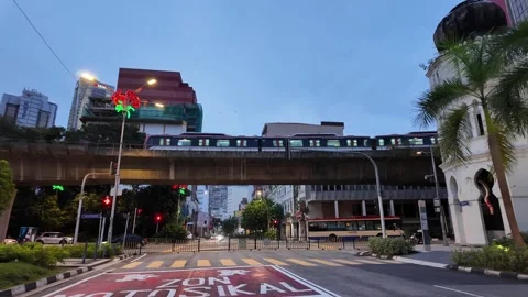 A LRT train is on a track in front of a building Video stock 318260892