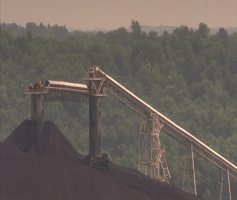 LS bulldozer pushing coal up coal pile Stock Footage 86696335