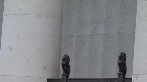 LS Names of the Dead Panels with Lion Statues at Menin Gate Memorial in Ypres Stock Footage 98187950