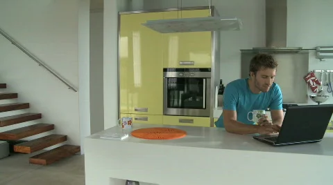 LS PAN OF A MAN USING A LAPTOP Stock Footage 542821