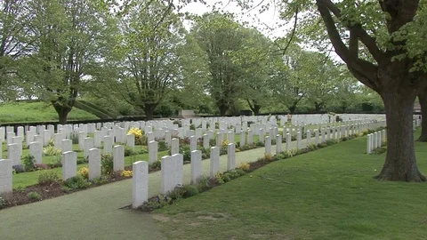 LS Rows of Gravestones in Line at Essex Farm Cemetery in Belgium Stock Footage