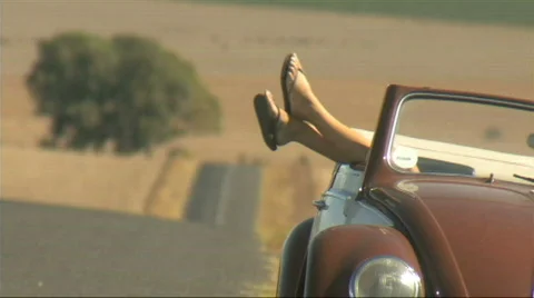 LS OF A YOUNG WOMAN LYING IN A CAR Stock Footage