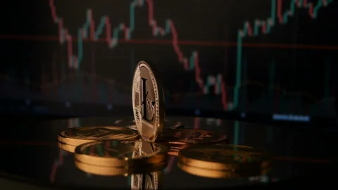 LTC Virtual cryptocurrency Litecoin coin rotating close up on market chat backgr Stock Footage 87478666