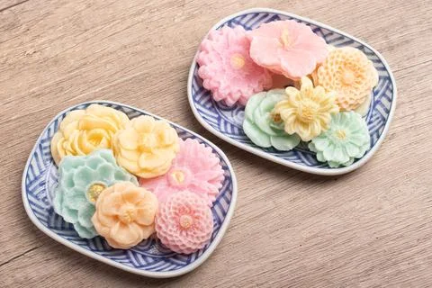 A-lua or Allure Thai handmade candy in a mini bowl on gray desktop. A-lua T.. Stock Photos