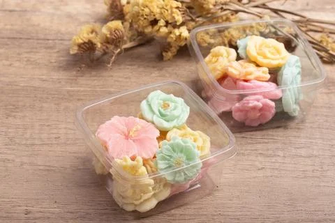 A-lua or Allure Thai handmade candy in a mini bowl on gray desktop. A-lua T.. Stock Photos