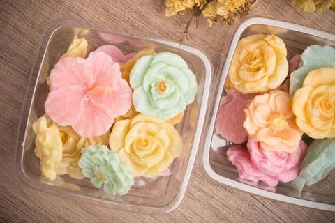 A-lua or Allure Thai handmade candy in a mini bowl on gray desktop. A-lua T.. Stock Photos