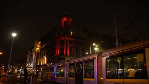 Luas Tram Passing Through Dublin City Center At Night Stock Footage 327624997