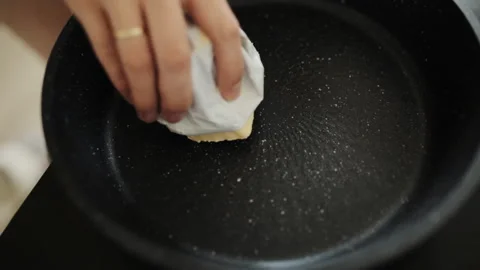 Lubricating the baking mold with butter Stock-Footage 88447194
