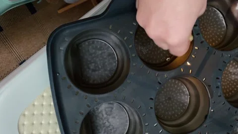 Lubricating the baking mold with butter Stock Footage 167506813