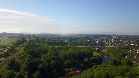 Luchos River and the train running away into the distance Stock Footage 100970967