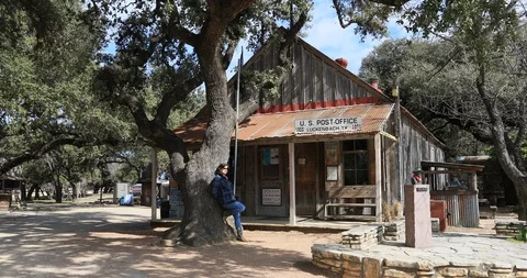 Luckenbach Texas historic Post Office town wife by tree 4K Stock Footage 103126526