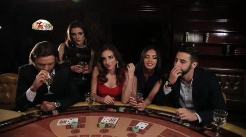 Luckiest girl in the red dress is Winning Money in the Casino Stock Footage