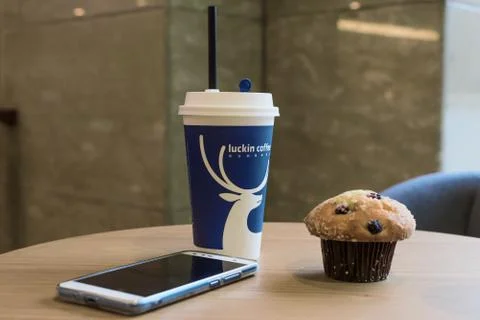 Luckin coffee cup on a table 스톡 사진