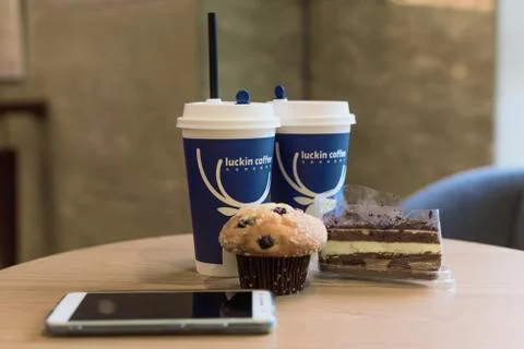 Luckin coffee cup on a table 스톡 사진