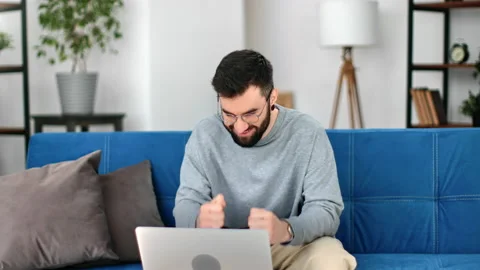 Lucky bearded man having good news received successful fortune email message Stock Footage 175672500