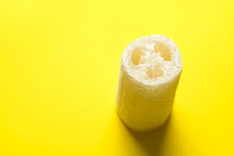 Luffa sponge for zero waste dish washing or bath on a yellow background Stock Photos