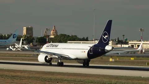 Lufthansa Airbus A320neo D-AINM begins its takeoff roll at Malta International Stock Footage 336504863