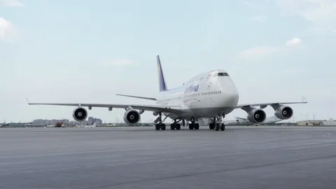 A Lufthansa B747 taxiing to the gate MS Stock Footage 91459548