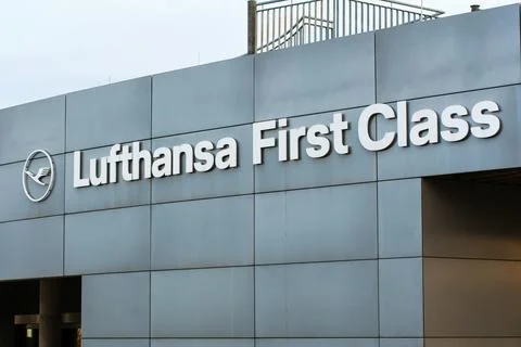 Lufthansa First Class Sign On Silver Building Facade Stock Photos