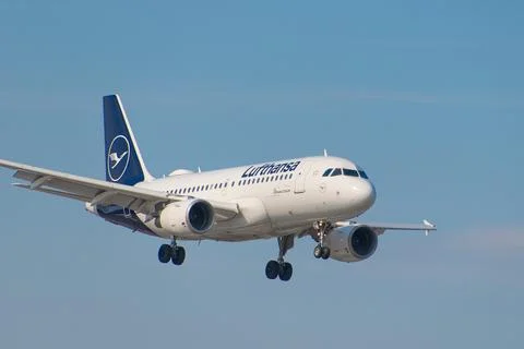 Lufthansa plane flies in the blue sky. March 21,2025. Warsaw, Poland. Stock Photos
