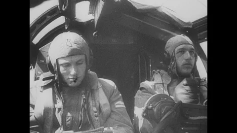 Luftwaffe pilots bomb and drop Paratroopers Stock Footage 103387725